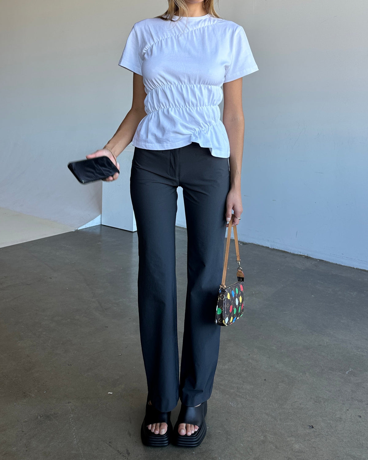 model:S/8AU H:171CM 
Charcoal Capsule Pants, front view, worn with a pale blue top.