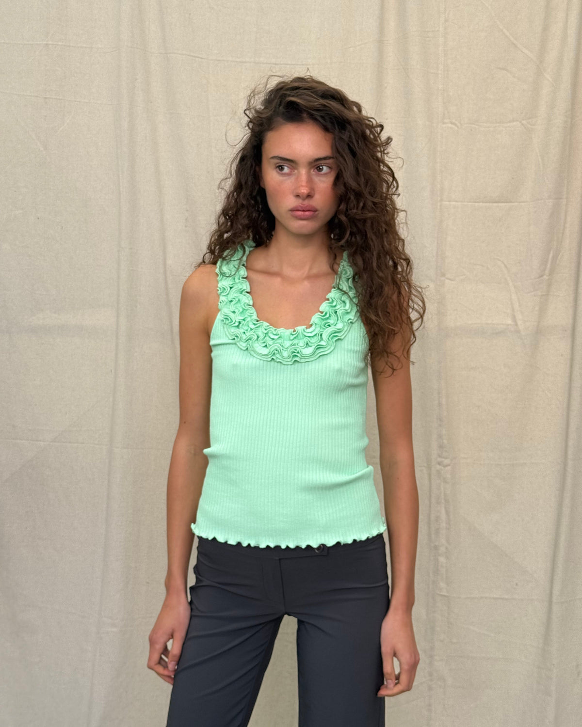 model:XS/6AU H:179CM
Front view of the mint Ruffle Knit Tank, showing its layered ruffle neckline, fitted ribbed body and lettuce-edge hem.
