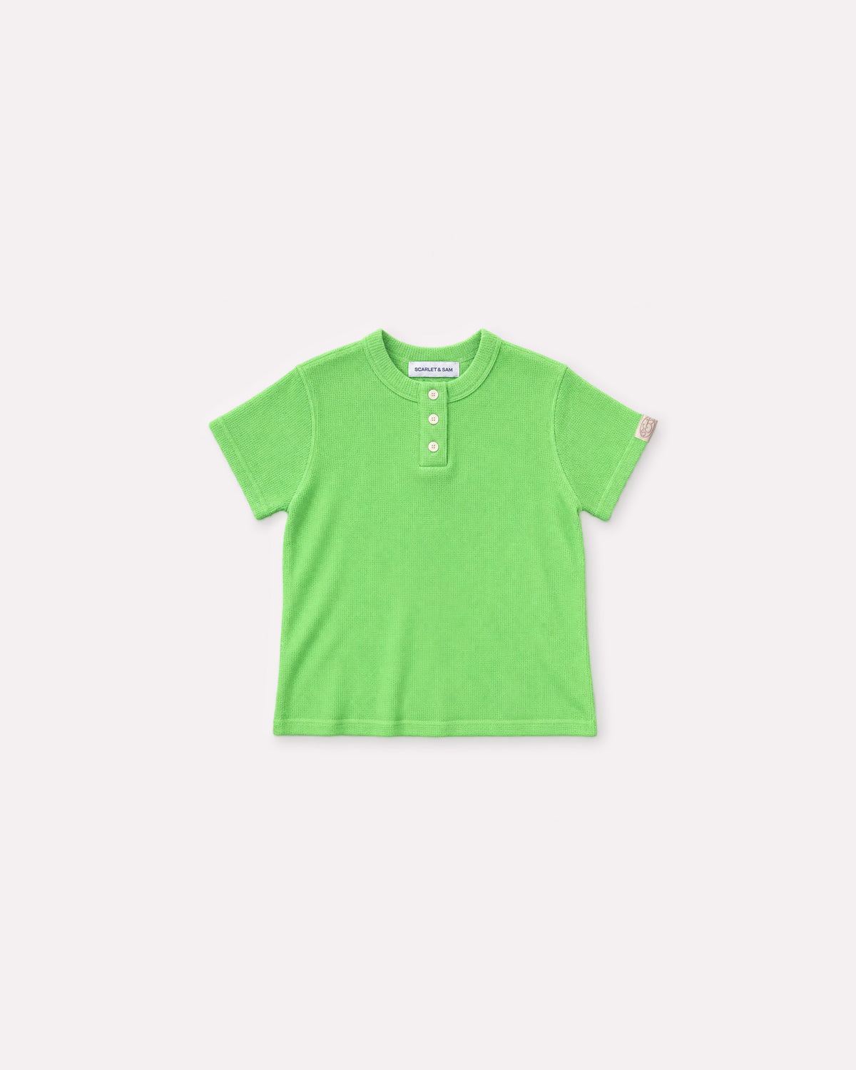 Lime Waffle Tee, front flat lay, showing the waffle texture, short sleeves, Henley button placket and sleeve logo tab.