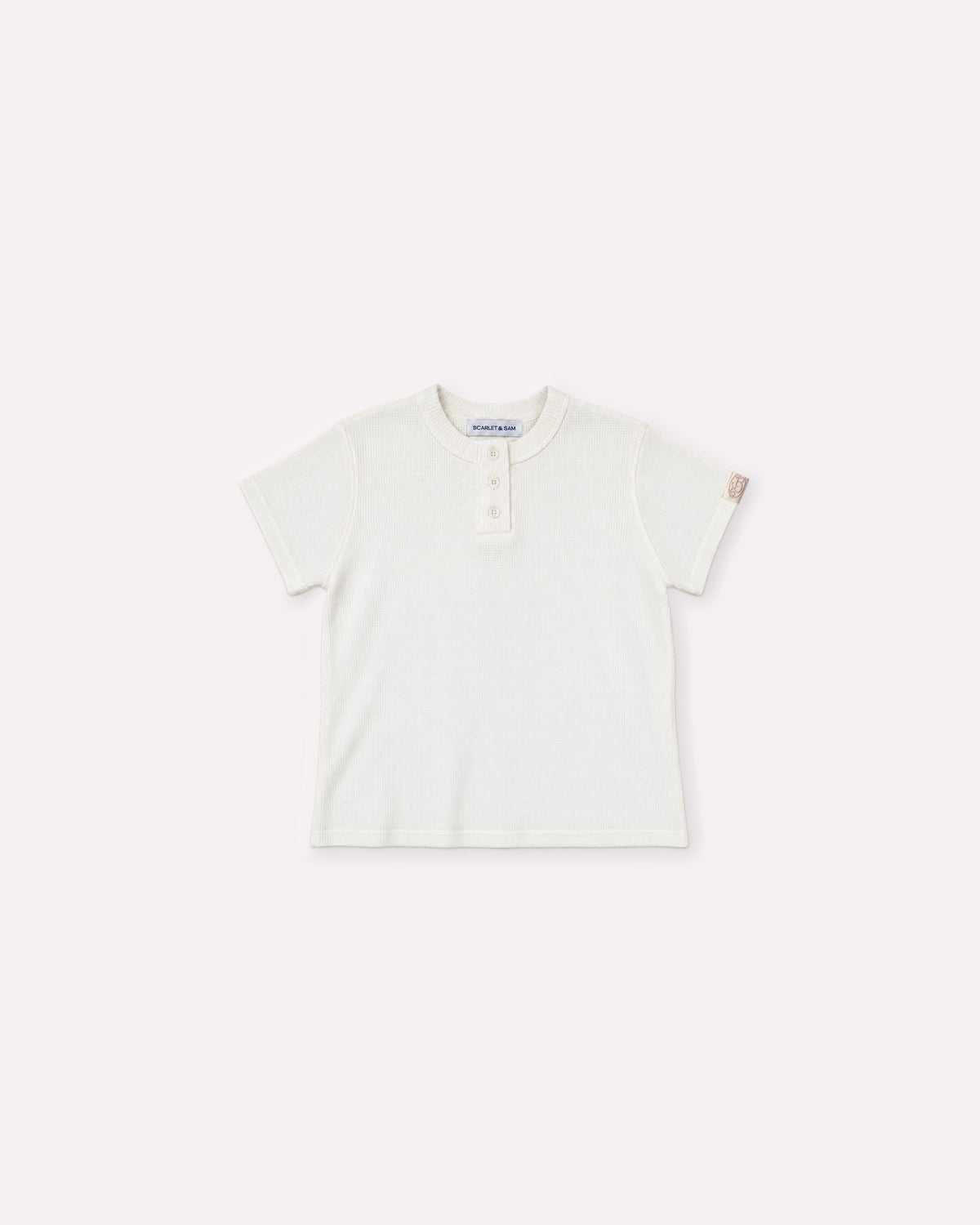 White Waffle Tee, front flat lay, showing the textured fabric, short sleeves, Henley button placket and sleeve logo tab.