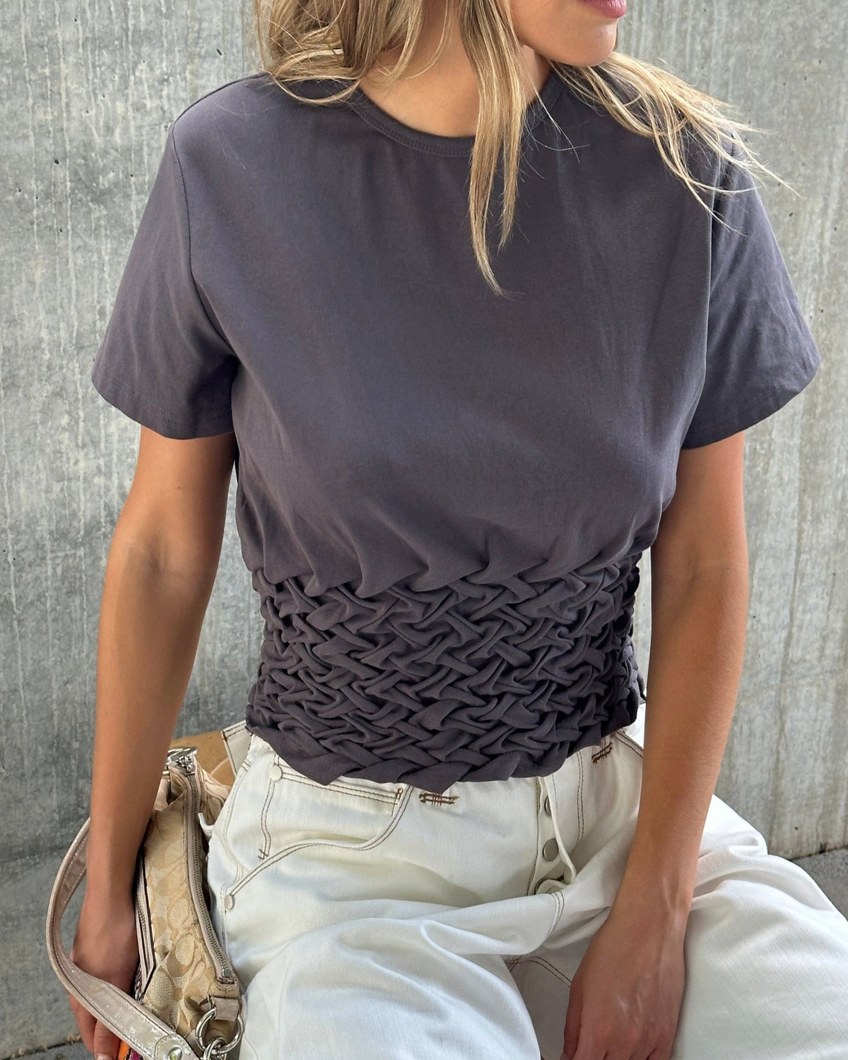 model:S/8AU 
Charcoal Braided Tilly Tee, close front view of the braided waist.
