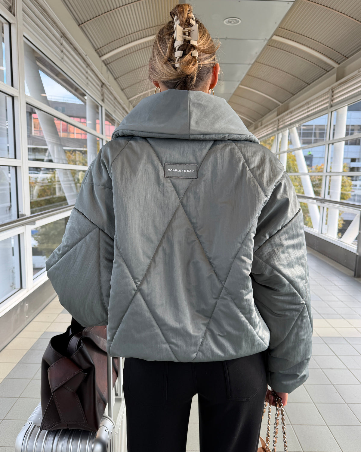 model:S/6-8AU H:171CM 
Steel Cocoon Padded Jacket, back view, showing the diamond quilting and wide collar.