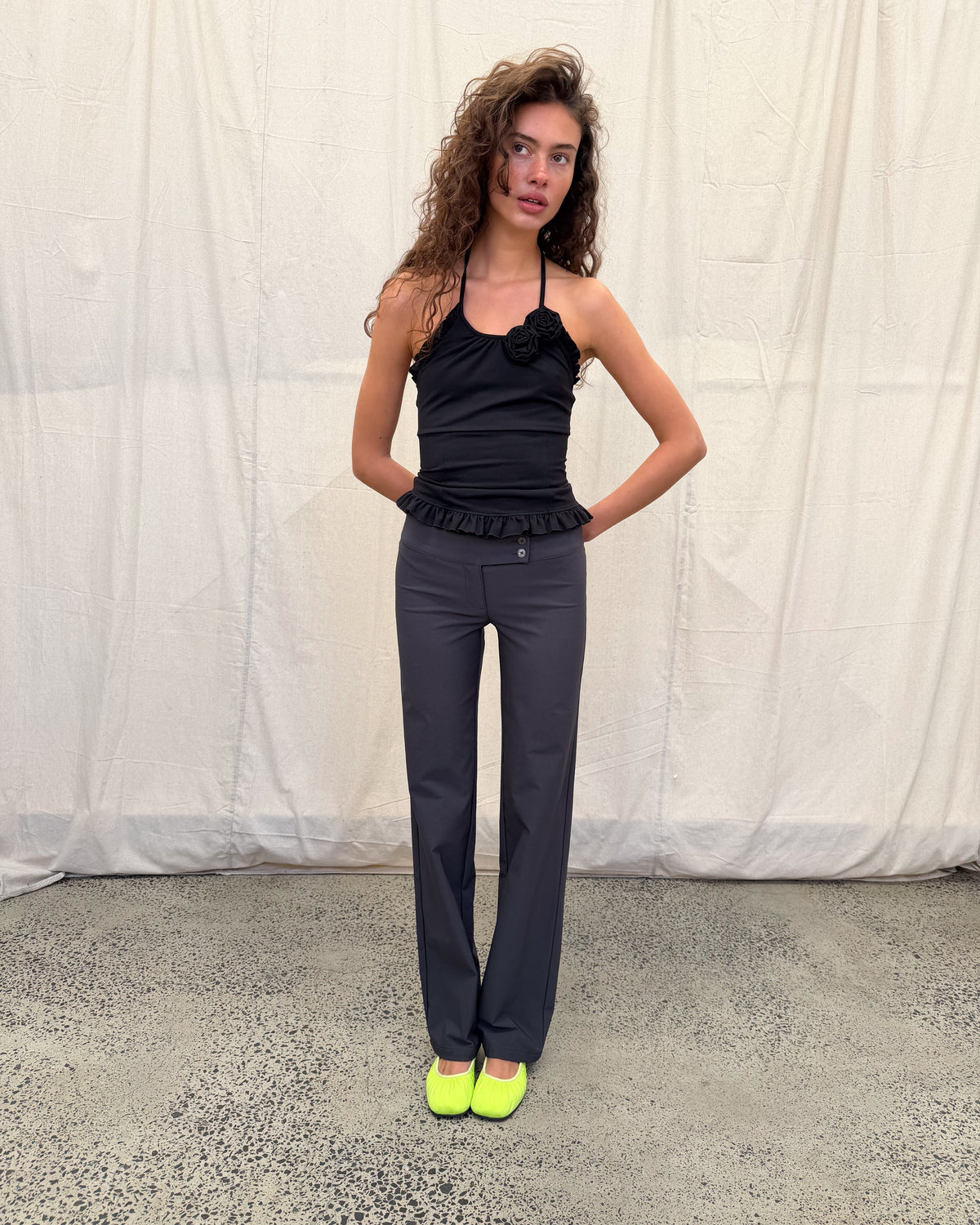 model:XS/6AU H:179CM 
Black Rose Sculpt Halter, full-length styling view with charcoal trousers and highlighter ballet flats.