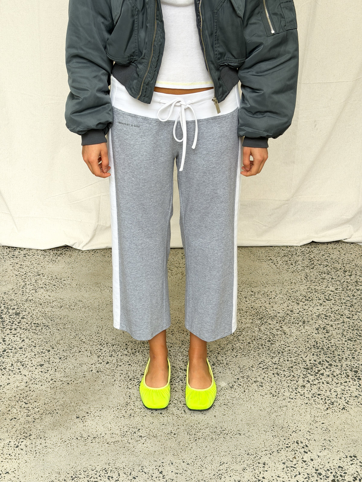 model:S/8AU H:169CM 
Grey Jersey Capri, styled with a charcoal bomber and bright ballet flats.