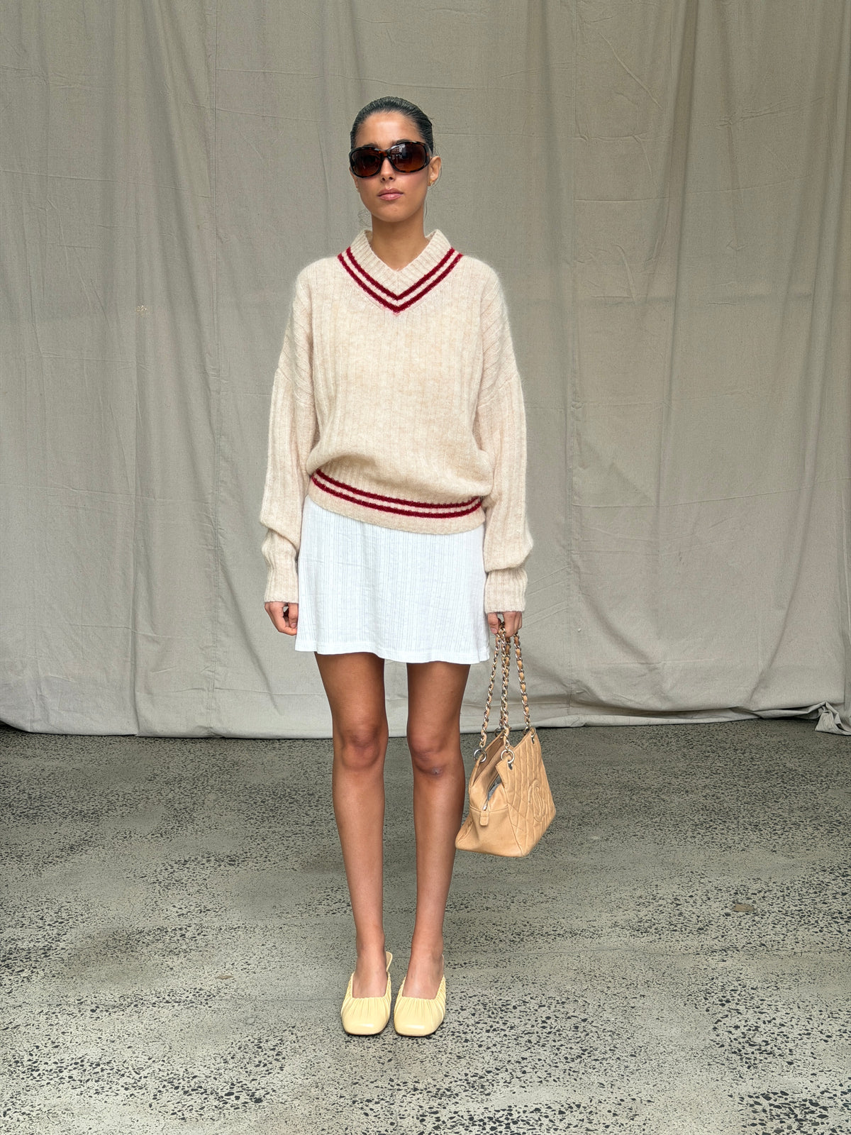 model:S/6-8AU 
Yellow Noa Ballet Wedges with a cream Mohair Rib Sweater and white skirt, full-length styling view.