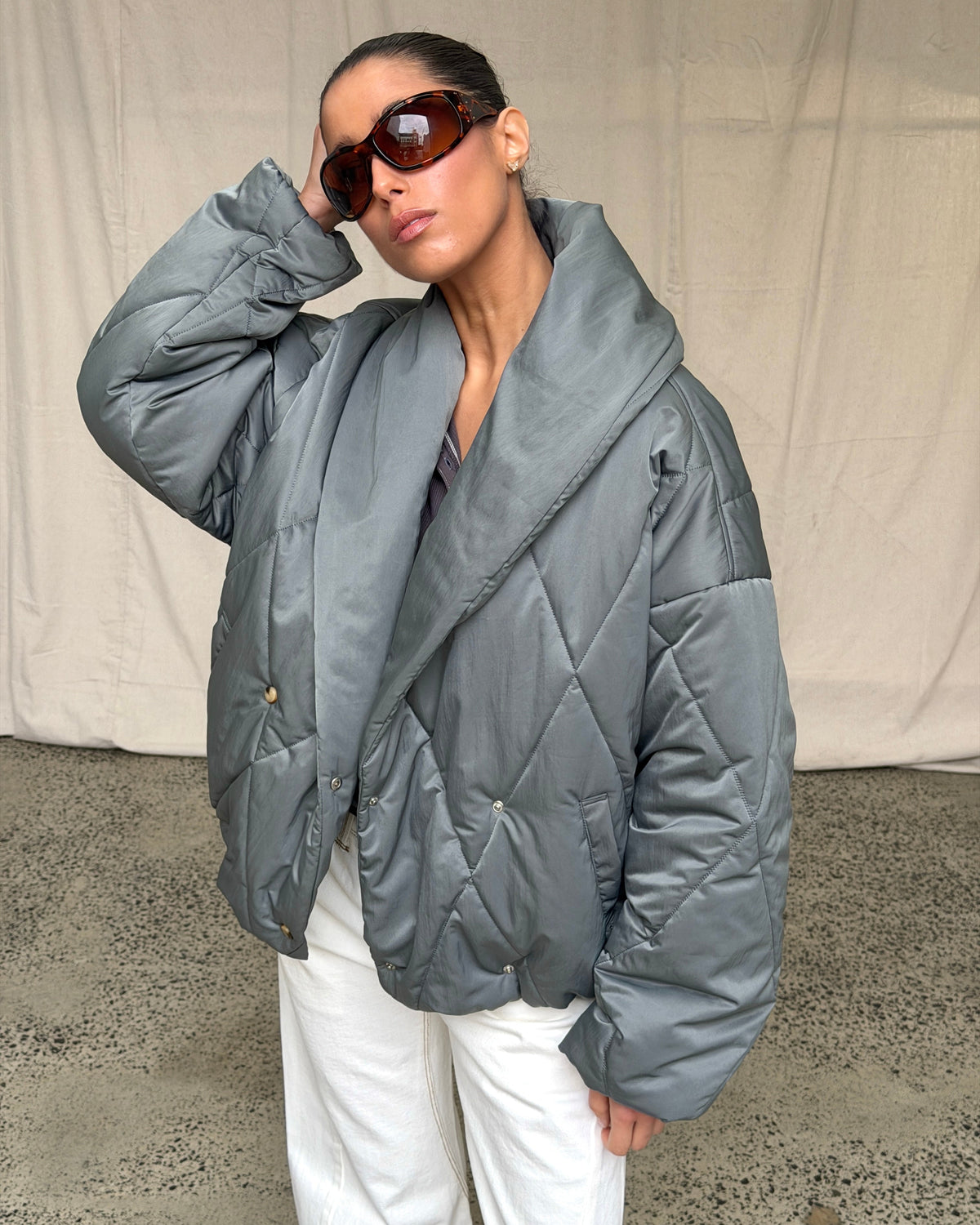 model:S/6-8AU H:169CM 
Steel Cocoon Padded Jacket, front view, styled with white trousers.