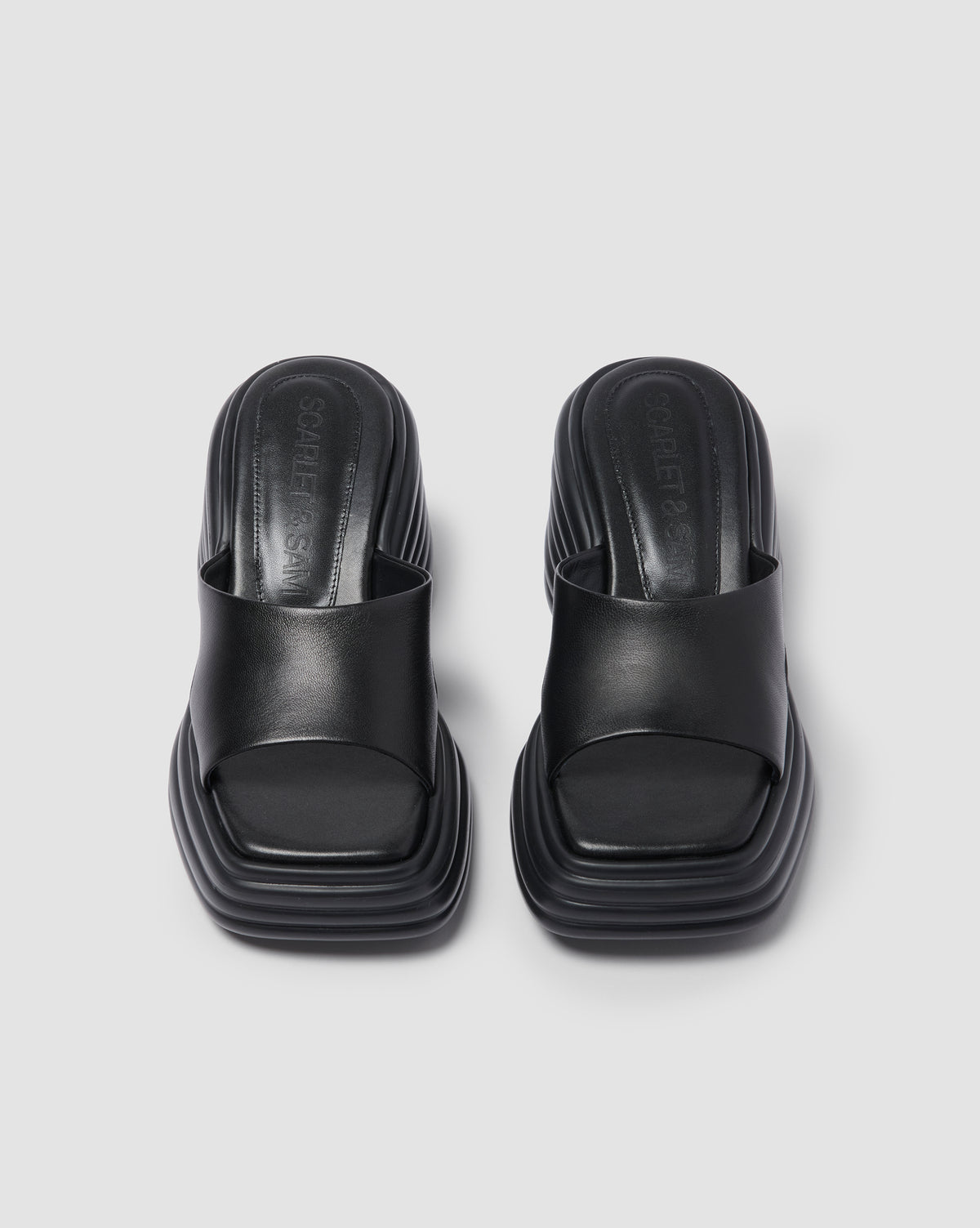 Black Juicy Wedge, pair viewed from above, showing the open toes and wide straps.
