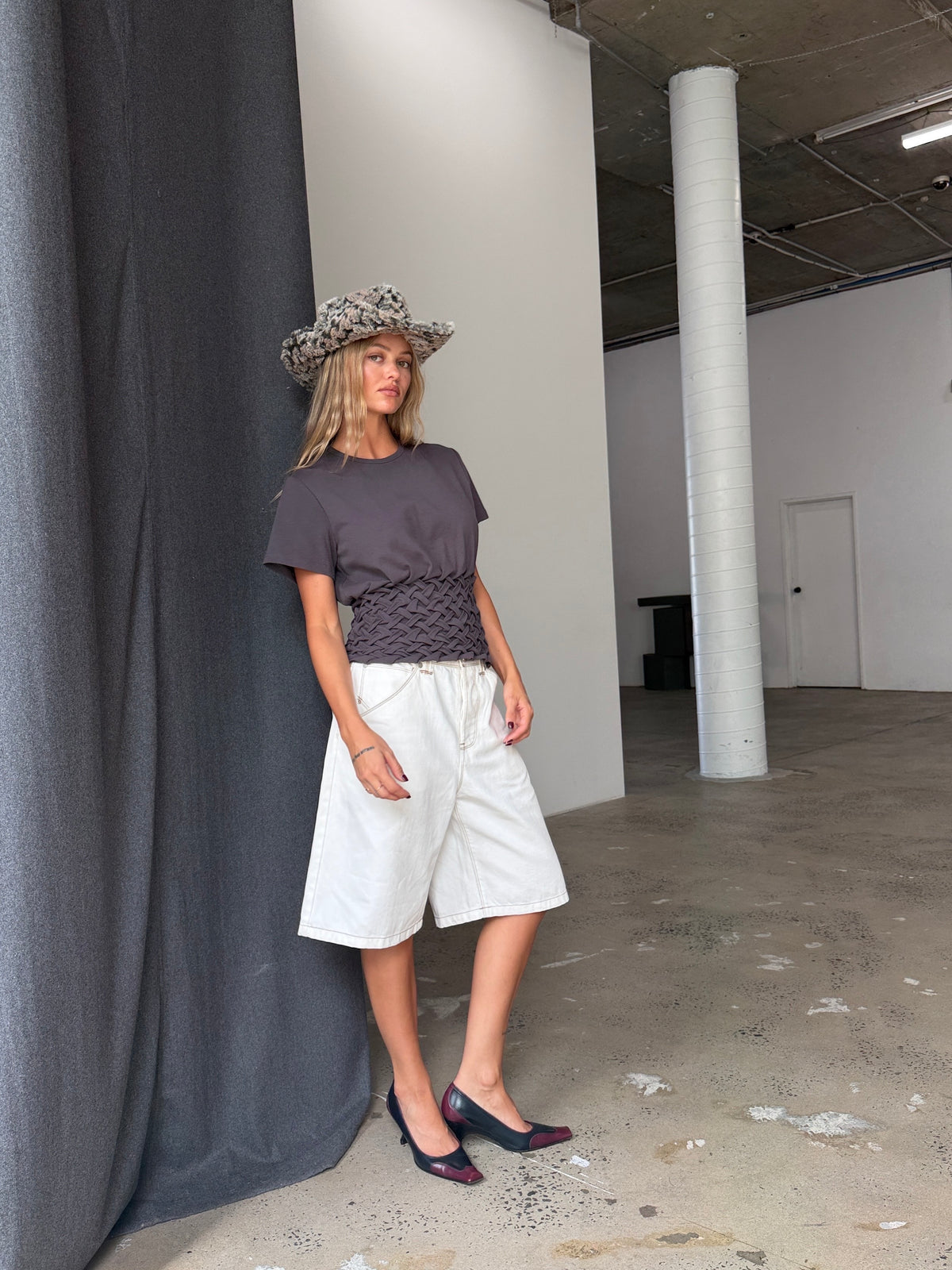 White Signature Belted Bermuda Short, full-length styling view with a charcoal tee.