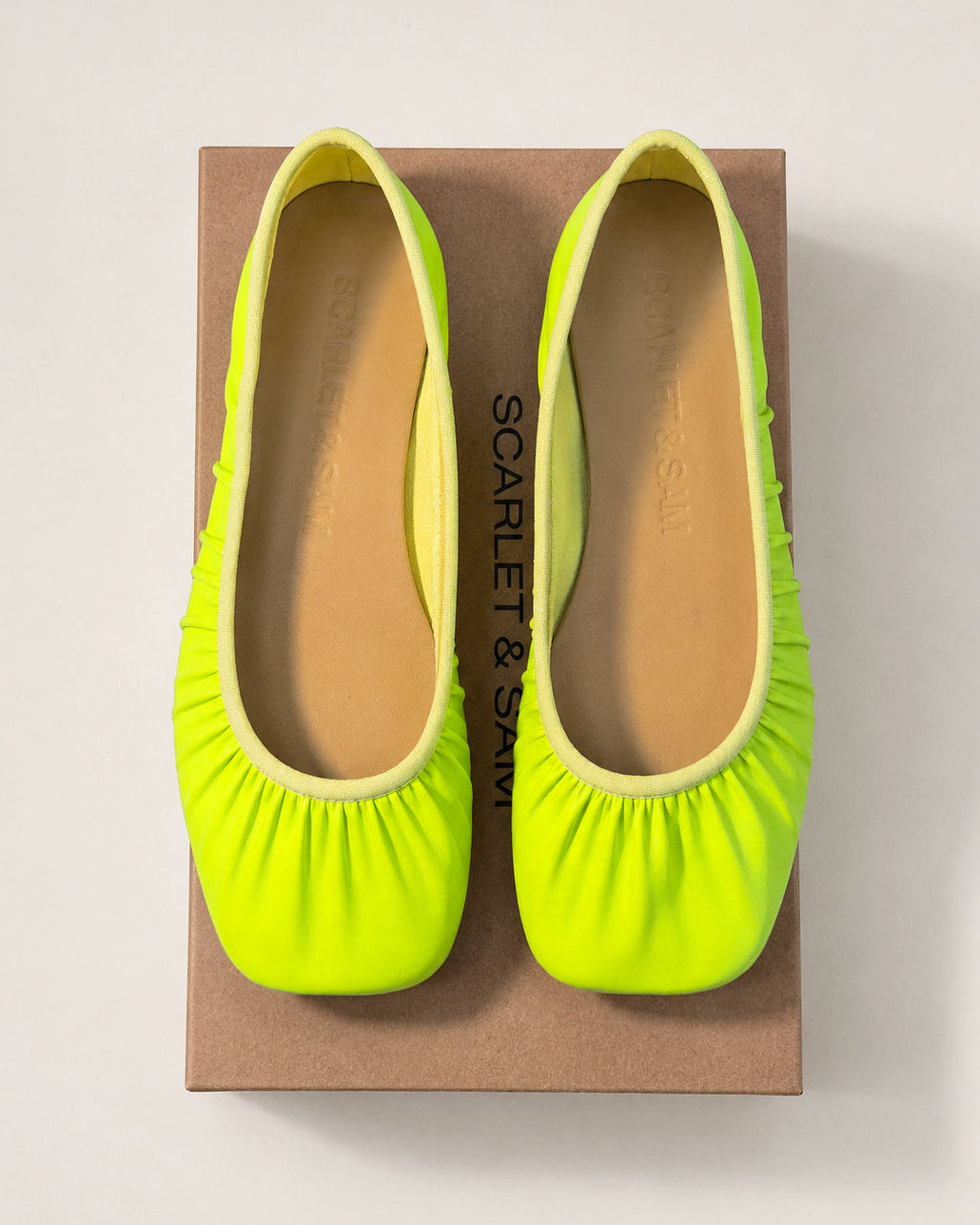 Highlighter Noa Neoprene Ballet Flat, pair viewed from above on a shoe box.