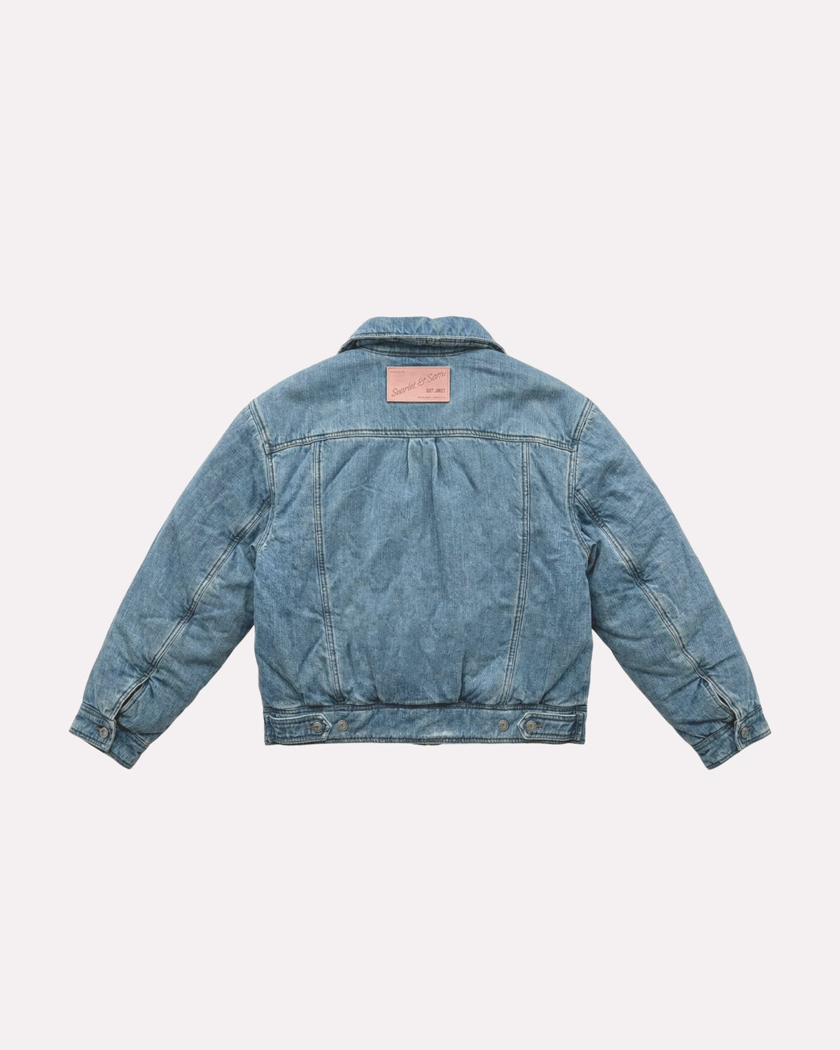 Denim Padded Denim Jacket, back view, laid flat to show the logo patch.